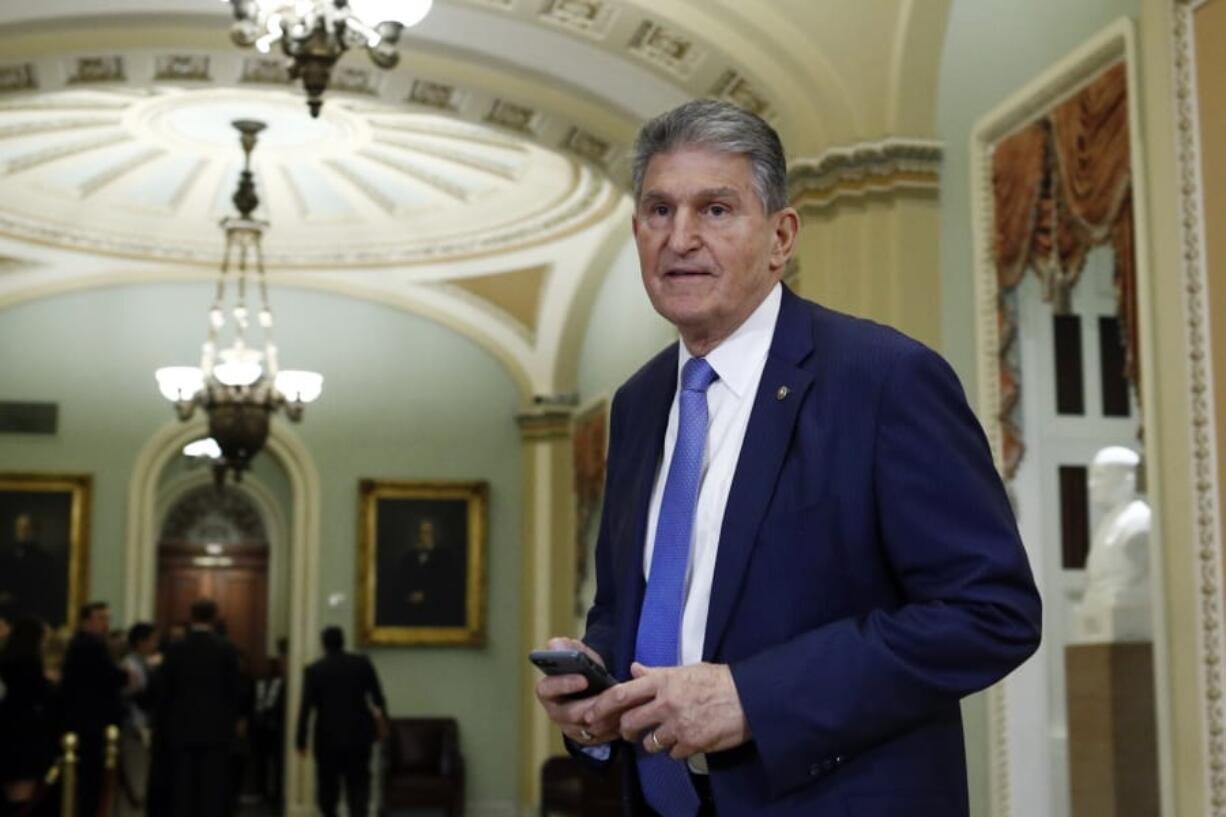 FILE - In this Wednesday Jan 29, 2020 file photo, Sen. Joe Manchin, D-W.Va., walks to the Senate chamber after a break in the impeachment trial of President Donald Trump at the U.S. Capitol in Washington. The U.S. Postal Service is considering closing post offices across the country, sparking worries ahead the anticipated surge of mail-in ballots in the 2020 elections, U.S. Sen Joe Manchin and a union leader said Wednesday, July 29, 2020.