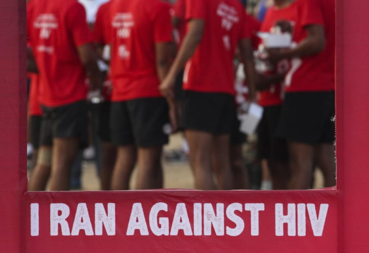 FILE - In this Dec. 1, 2018, file photo, Indians participate in a health awareness run to mark World AIDS Day in Hyderabad, India. New numbers on the global AIDS epidemic show some big successes such as fewer deaths and new infections. But there are also some tragic failures: Only half of children with HIV, the virus that causes the disease, are getting treatment. UNAIDS, a United Nations agency, reported last year&#039;s numbers Monday, July 6, 2020, at the start of an international AIDS conference.