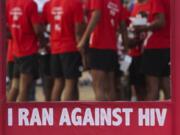 FILE - In this Dec. 1, 2018, file photo, Indians participate in a health awareness run to mark World AIDS Day in Hyderabad, India. New numbers on the global AIDS epidemic show some big successes such as fewer deaths and new infections. But there are also some tragic failures: Only half of children with HIV, the virus that causes the disease, are getting treatment. UNAIDS, a United Nations agency, reported last year&#039;s numbers Monday, July 6, 2020, at the start of an international AIDS conference.