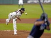 Houston Astros starting pitcher Lance McCullers Jr., left, throws to Seattle Mariners&#039; Evan White during the first inning of a baseball game Saturday, July 25, 2020, in Houston. (AP Photo/David J.