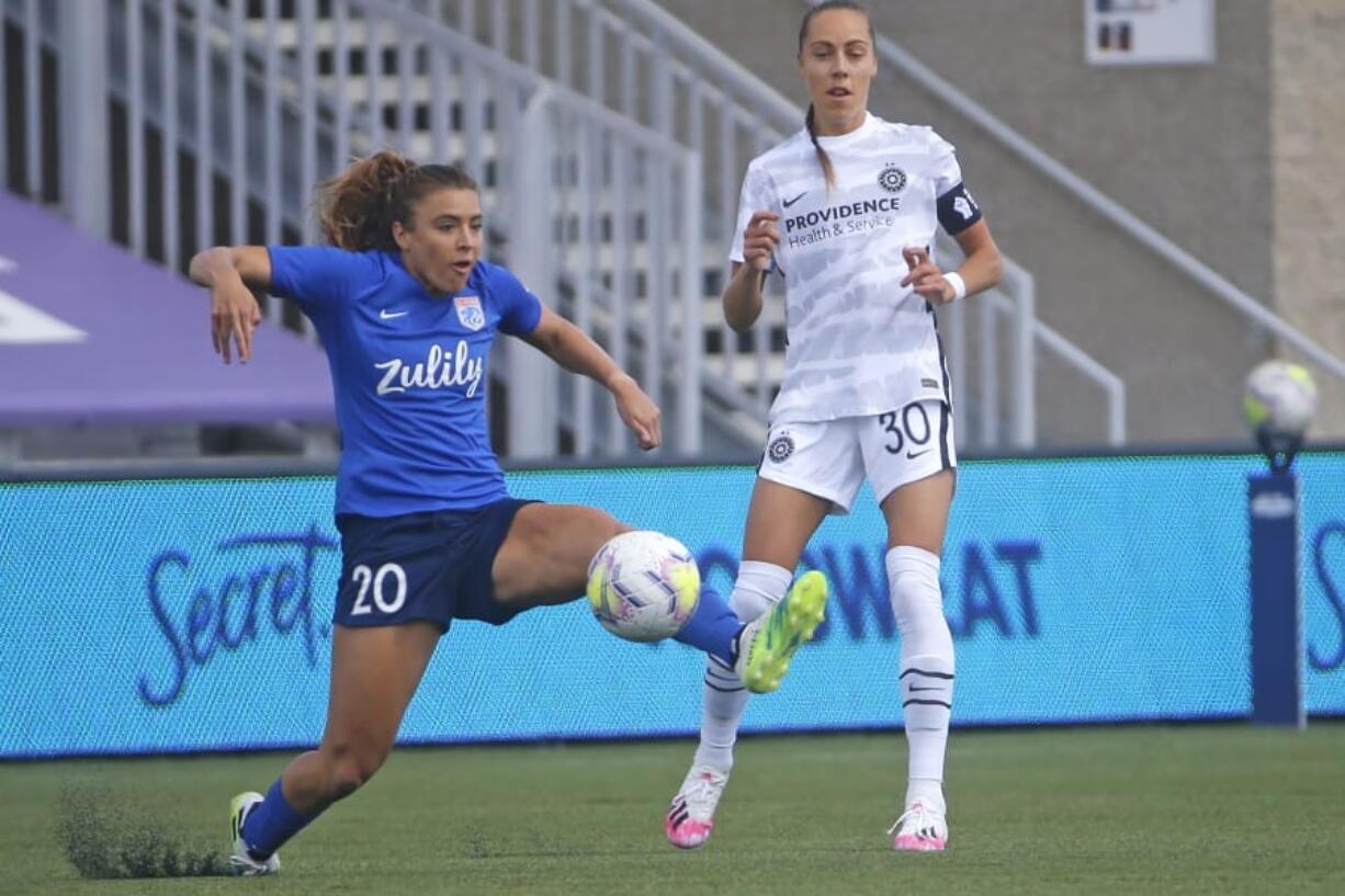 OL Reign forward Sofia Huerta (20) controls the ball as Portland Thorns midfielder Celeste Boureille (30) defends during the first half of an NWSL Challenge Cup soccer match at Zions Bank Stadium Monday, July 13, 2020, in Herriman, Utah.