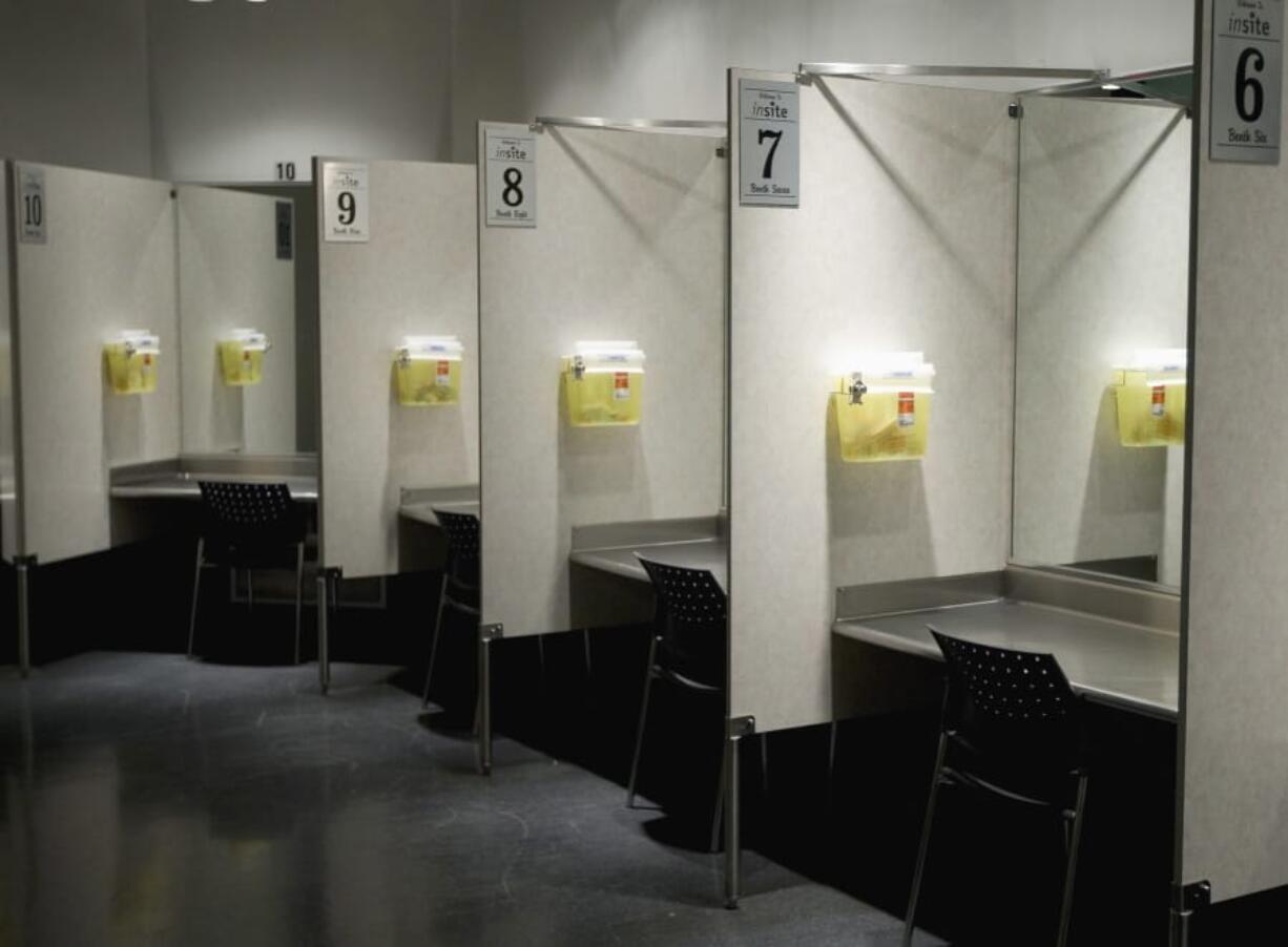 FILE - This Tuesday, May 6, 2008, file photo shows injection booths at a facility in Vancouver, British Columbia, Canada. According to research published in the New England Journal of Medicine on Wednesday, July 8, 2020, a safe haven in the U.S., where drug users can give themselves heroin and other drugs has observed more than 10,500 injections over five years and treated 33 overdoses with none proving fatal. Such facilities may curb deaths from the opioid epidemic, which kills nearly 70,000 people each year in the United States.