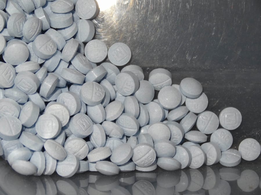 FILE - This photo provided by the U.S. Attorneys Office for Utah and introduced as evidence in a 2019 trial shows fentanyl-laced fake oxycodone pills collected during an investigation. In a resumption of a brutal trend, nearly 71,000 Americans died of drug overdoses in 2019 according to the Centers for Disease Control and Prevention, a new record high that predates the COVID-19 crisis. The numbers were driven by fentanyl and similar synthetic opioids, which accounted for 36,500 overdose deaths. (U.S.