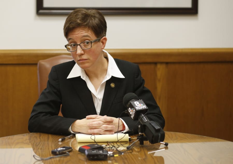 FILE - In this Feb. 12, 2015, file photo, Oregon House SpeakerTina Kotek, D-Portland, listens to a question during a news conference in her office at the Capitol in Salem, Ore. Police declared a riot, made multiple arrests and used tear gas to disperse protesters in a residential neighborhood in Portland, Ore., as unruly demonstrations continue in the city. The Portland Police Bureau said Wednesday, July 1, 2020, they arrested 28 protesters on charges including disorderly conduct, interfering with a police officer, riot and assault on a police officer during protests late Tuesday that stretched into the early morning hours. Kotek condemned the police response and the use of tear gas on Wednesday in a strongly worded letter to Mayor Ted Wheeler that called the officers&#039; actions &quot;unacceptable.&quot; (AP Photo/Timothy J.