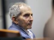 FILE - In this March 10, 2020, file photo, real estate heir Robert Durst looks over during his murder trial in Los Angeles. At a hearing Friday, July 17, 2020, on the resumption of the murder trial of Durst, a Los Angeles judge said it won&#039;t resume in late July as planned, and may stay on hold until April.