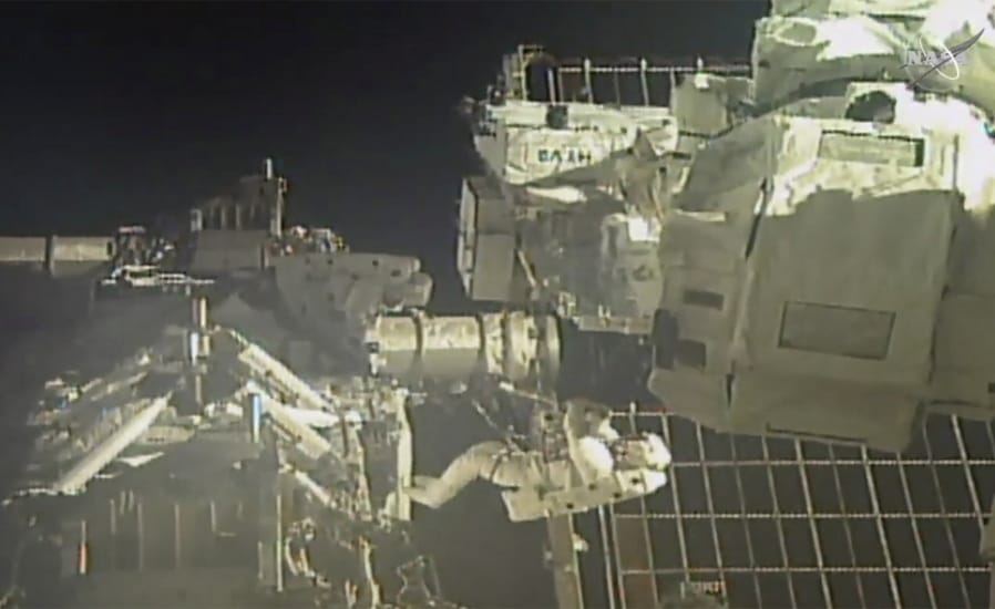 In this image taken from NASA video, commander Chris Cassidy, right, and NASA astronaut Bob Behnken perform their second spacewalk in under a week Wednesday, July 1, 2020, to replace old batteries outside the International Space Station.