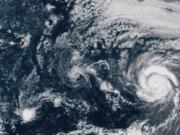 This GOES-17 taken at 3:30 p.m. EDT, Thursday, July 23, 2020, shows Hurricane Douglas, right, churning in the Pacific Ocean heading towards Hawaii, left. The storm is currently a Category 3 hurricane but is expected to weaken before it arrives in the state this weekend.