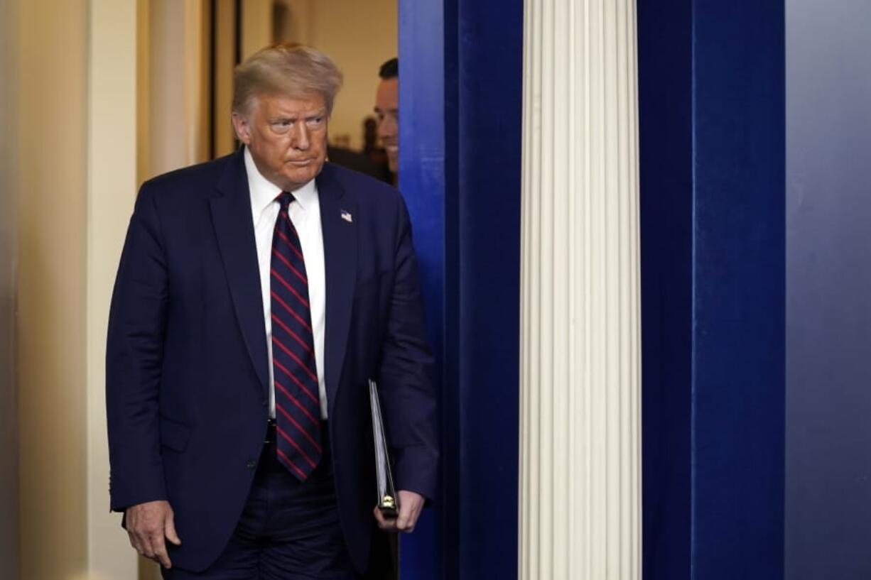 President Donald Trump arrives to speak at a news conference at the White House, Thursday, July 30, 2020, in Washington.