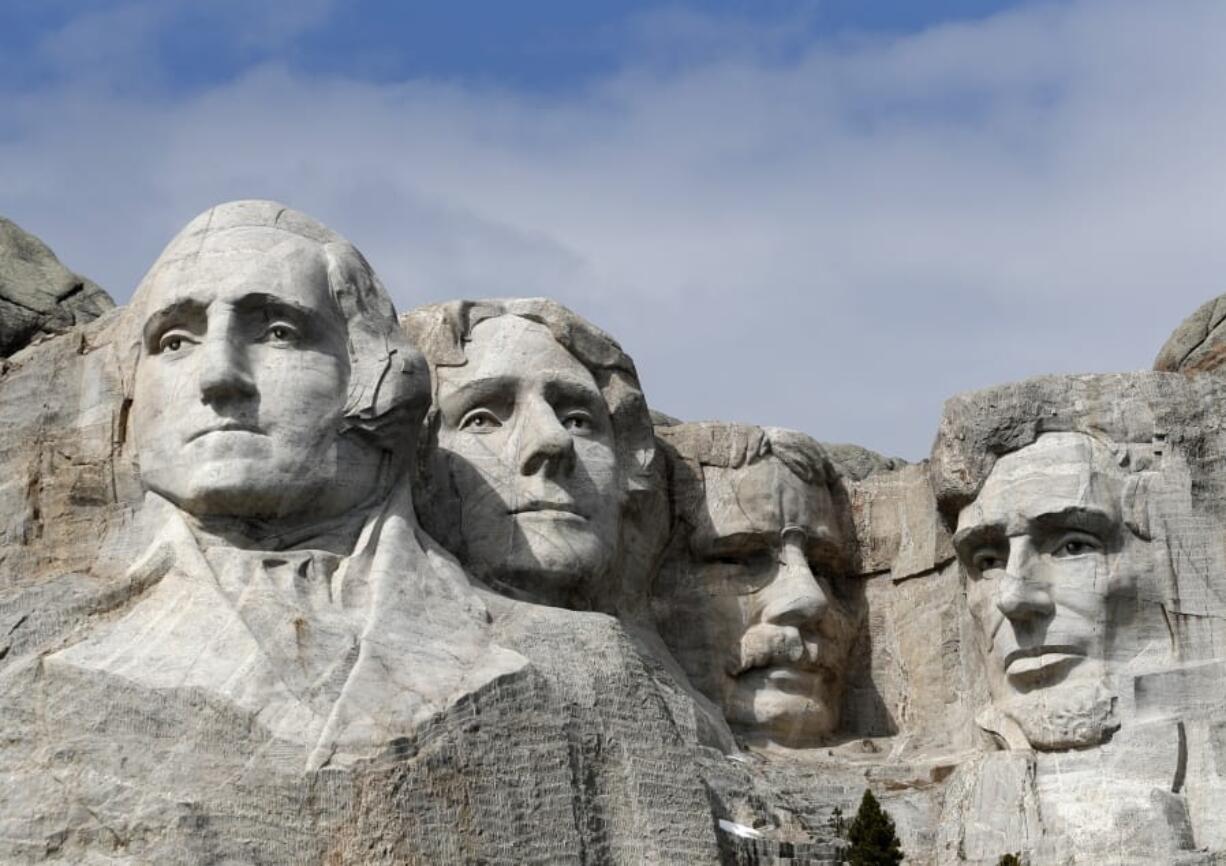 FILE - This March 22, 2019, file photo shows Mount Rushmore in Keystone, S.D.  President Donald Trump will begin his Independence Day weekend on Friday with a patriotic display of fireworks at Mount Rushmore National Memorial before a crowd of thousands.