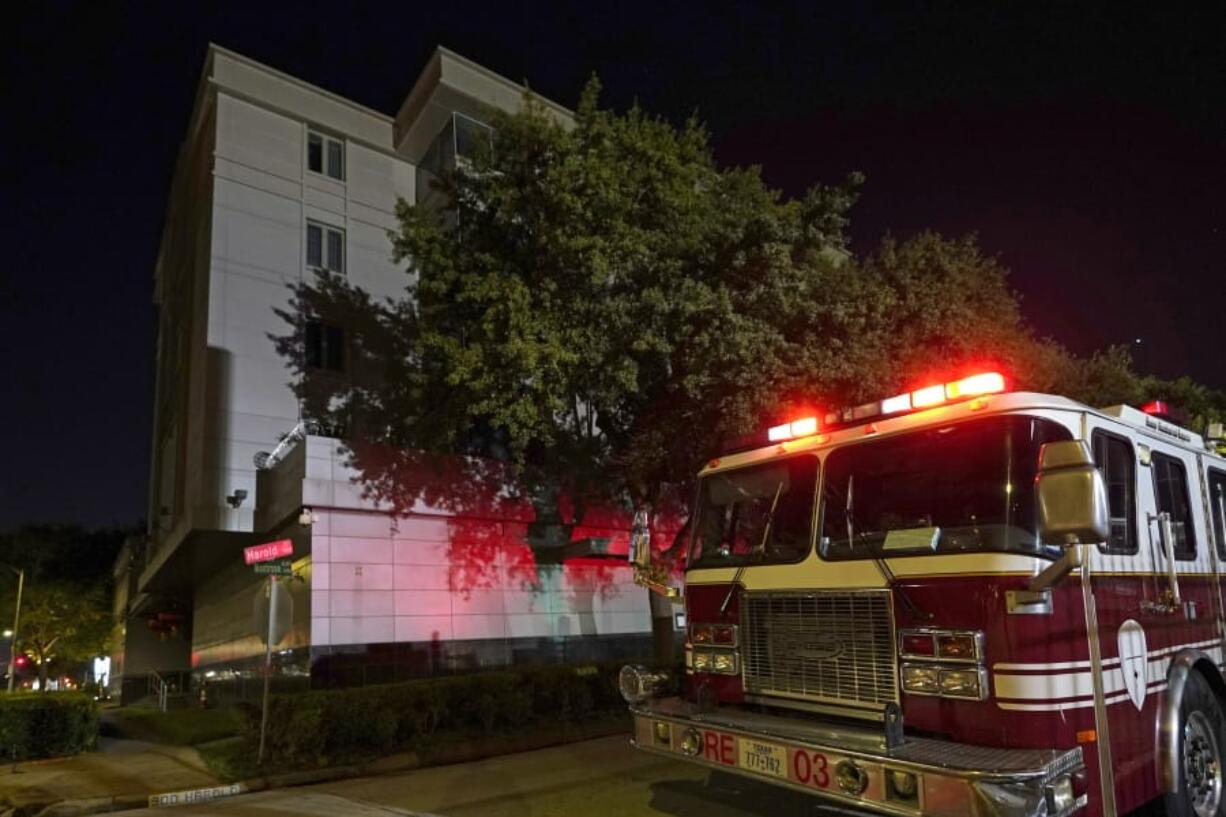 A firetruck is positioned outside the Chinese Consulate Wednesday, July 22, 2020, in Houston. Authorities responded to reports of a fire at the consulate. Witnesses said that people were burning paper in what appeared to be trash cans, according to police. China says the U.S. has ordered it to close its consulate in Houston in what it called a provocation that violates international law. (AP Photo/David J.