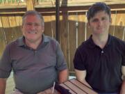 Buck Newsome, left, a baby boomer, and his son, Chris Newsome, of the millennial generation, have lunch together June 26 in Newtown, Ohio. American&#039;s two largest generations can agree on something: the coronavirus pandemic has hit them both hard.