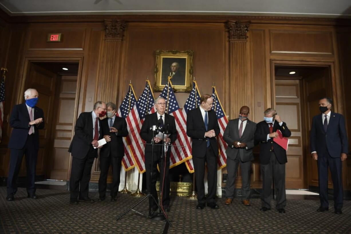 Senate Majority Leader Mitch McConnell of Ky., during a news conference on on Capitol Hill in Washington, Monday, July 27, 2020, to highlight their proposal for the next coronavirus stimulus bill. McConnell is joined by, from left, Sen. John Cornyn, R-Texas, Sen. Lamar Alexander, R-Tenn., Sen. Roy Blunt, R-Mo., Sen. Richard Shelby, R-Ala., Sen. Tim Scott, R-S.C., Sen. Lindsey Graham, R-S.C., and Sen. Mitt Romney, R-Utah.