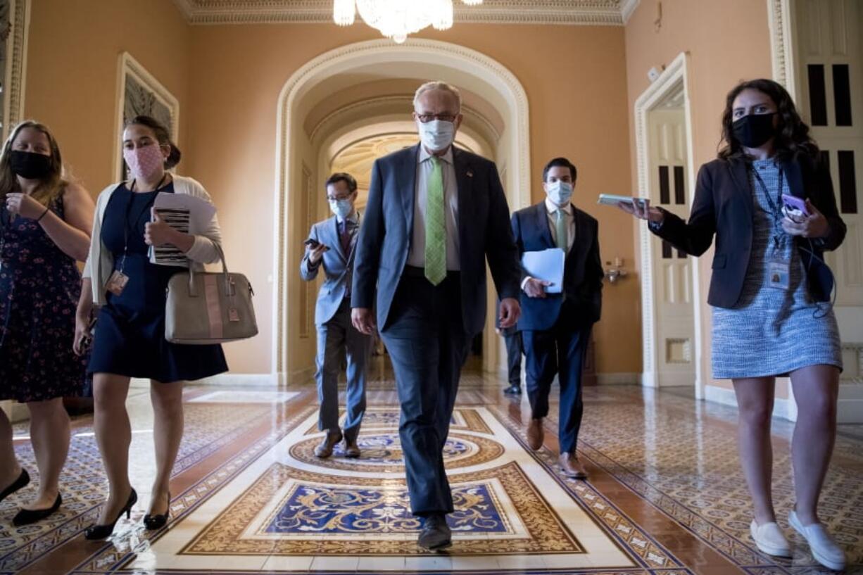 Senate Minority Leader Sen. Chuck Schumer of N.Y. walks to the office of House Speaker Nancy Pelosi of Calif., on Capitol Hill in Washington, Wednesday, July 29, 2020, for a meeting with Pelosi, President Donald Trump&#039;s Chief of Staff Mark Meadows, and Treasury Secretary Steven Mnuchin.