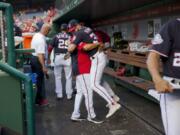 Washington Nationals Bryce Harper is hugged and lifted off the ground by his manager Dave Martinez in the dugout during a game in 2018. High fives and fist bumps are out. Hugs are a no-go. And just like crying, there&#039;s no spitting in baseball, at least for now. Things sure will be different when it&#039;s time to play ball in two weeks.