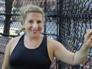 Lauren Wire, a 32-year-old publicist who lives in Manhattan, poses for a portrait before a fitness class Wednesday, July 15, 2020, in New York. Many Americans are changing clothing sizes depending on how they spent their time sheltering at home. Wire gained back 12 of the 50 pounds she lost leading up to the pandemic because she was ordering in a lot from restaurants and partaking in social distance cocktails with friends. She says she bought new shorts and swimwear when she gained the weight but now she&#039;s starting to shed pounds again by biking outside.