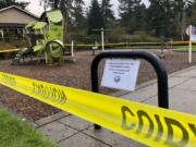 FILE - In this March 24, 2020, file photo, police caution tape surrounds a playground in Lake Oswego, Ore., during the coronavirus outbreak. Oregon health officials reported its second-highest tally of confirmed cases of COVID-19 and five additional deaths on Friday, June 26, 2020, the same day that authorities released new modeling that shows increased transmission of the coronavirus since the state began reopening in mid-May.