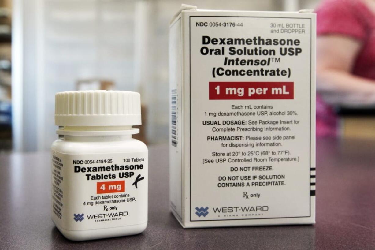 FILE - This Tuesday, June 16, 2020 file photo shows a bottle and box for dexamethasone in a pharmacy in Omaha, Neb. On Friday, July 17, 2020, British researchers published a report on the only drug shown to improve survival -- the inexpensive steroid dexamethasone. Two other studies found that the malaria drug hydroxychloroquine does not help people with only mild coronavirus symptoms.