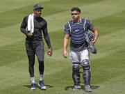 New York Yankees relief pitcher Aroldis Chapman, left, leaves the field after a bullpen session with catcher Gary Sanchez after a bullpen session during a baseball summer training camp workout Sunday, July 5, 2020, at Yankee Stadium in New York.