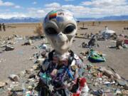 An alien statue overlooks a vortex field at the UFO Watchtower near Hooper, Colo.