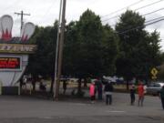 Supporters hold up signs and wave at passing cars in front of Crosley Lanes on Saturday, Aug. 8, 2020, during a Rally for the Alley to help get bowling centers reopened in the state.