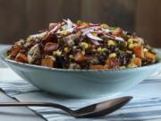 A chilled salad of black and brown rice contrasts beautifully with yellow corn, red radishes, orange squash and bright green herbs.