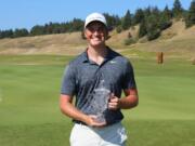 Brian Humphreys of Vancouver holds up the second-place trophy at the Washington Golf Men’s Amateur on Thursday, Aug. 13, 2020.