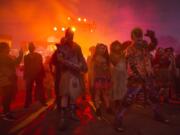 Monsters wait for the gates to open to greet guests at Queen Mary&#039;s Dark Harbor Halloween celebration.