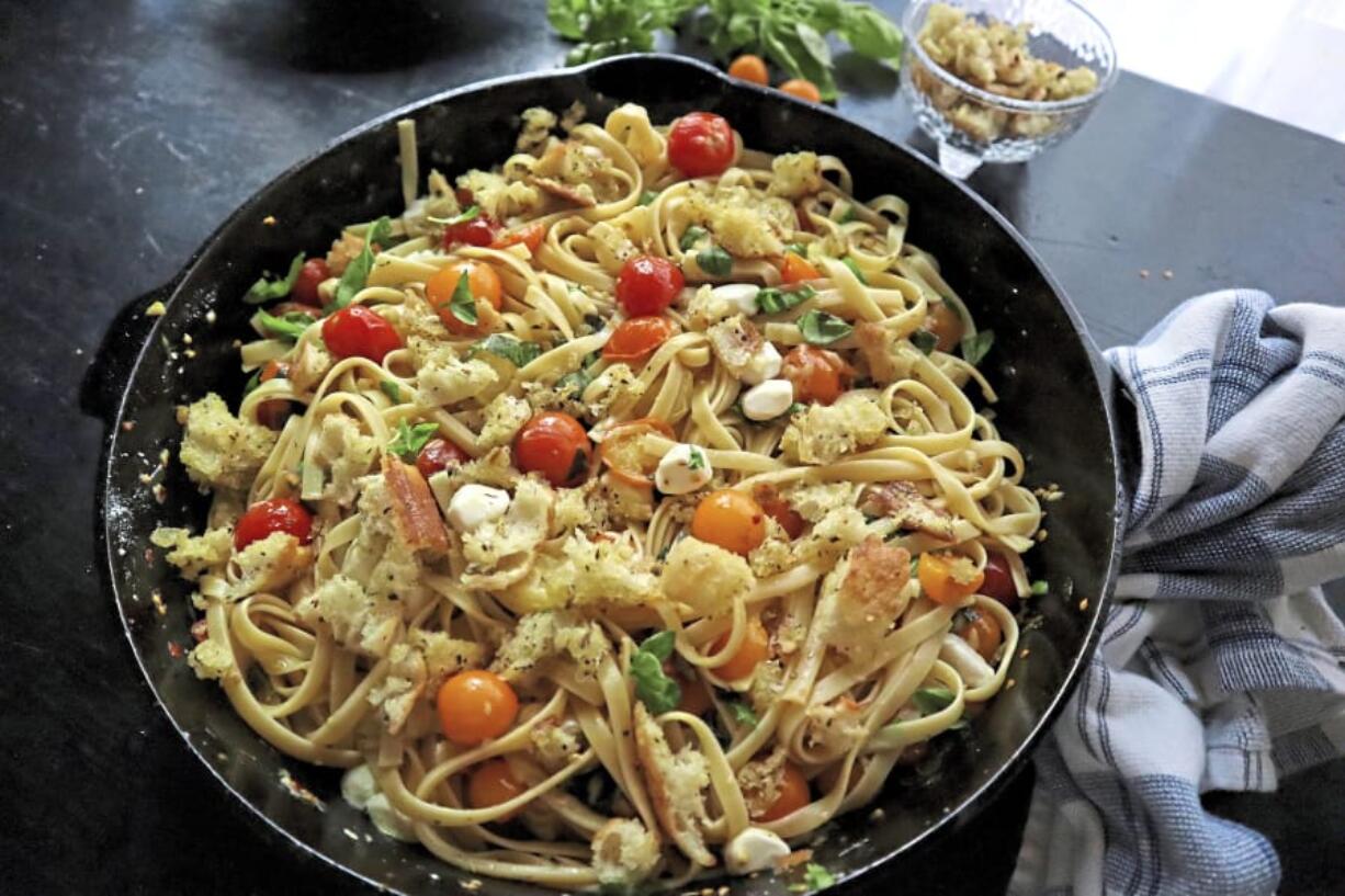 Pasta tossed with charred cherry tomatoes, basil and mozzarella makes an easy and quick dinner.