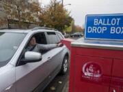 Vancouver resident Erik Hess swings by the ballot drop-off box on West 14th Street on Nov. 5, 2019.