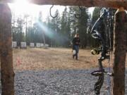 Caitlin Lohner, 14, of LaPine retrieves her arrows while practicing at the new archery range in Kelly Young Memorial Park in LaPine, Ore.