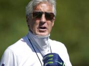 Seattle Seahawks head coach Pete Carroll briefly pulls down his face covering during NFL football training camp, Monday, Aug. 24, 2020, in Renton, Wash. (AP Photo/Ted S.