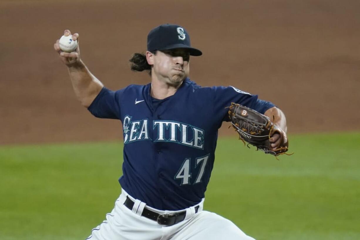 Seattle Mariners closing pitcher Taylor Williams throws to a Los Angeles Dodgers batter during the ninth inning of a baseball game Wednesday, Aug. 19, 2020, in Seattle. The Mariners won 6-4.