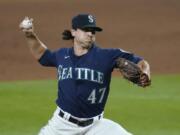 Seattle Mariners closing pitcher Taylor Williams throws to a Los Angeles Dodgers batter during the ninth inning of a baseball game Wednesday, Aug. 19, 2020, in Seattle. The Mariners won 6-4.