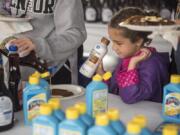 The Columbian files 
 Makayla Killam, 5, watches as syrup is poured onto her pancakes at the 2019 Clark County Fair.