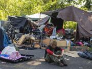 Aaron Anthony Christopher spends a quiet moment at his homeless encampment in northeast Vancouver in July.