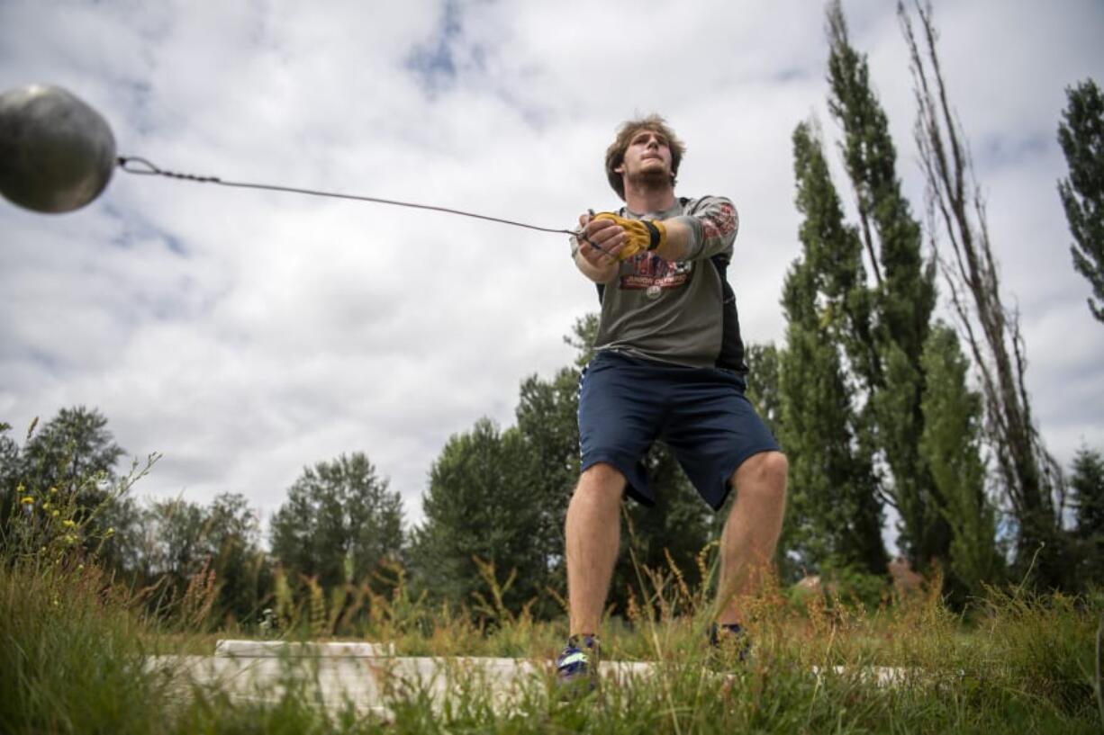 Trey Knight runs through a hammer throwing session at his home in Ridgefield on July 23, 2020. Knight is headed to USC in Los Angeles, Ca., next month to continue his track career.