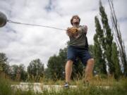 Trey Knight runs through a hammer throwing session at his home in Ridgefield on July 23, 2020. Knight is headed to USC in Los Angeles, Ca., next month to continue his track career.