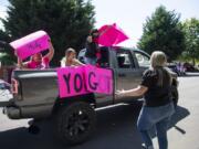 Sherry Cianni, from left, Madilynn Reagan and Gina Salt drive by Heather James&#039; home in Felida during a parade of support Saturday. James was diagnosed with breast cancer in April so her friends and co-workers decided to organize the socially-distanced parade. Cianni is also battling breast cancer, so she and James have been able to support each other.