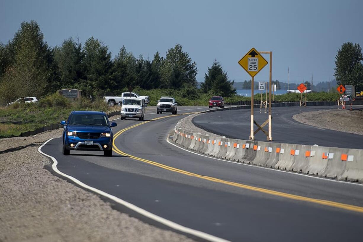 Motorists traveling east on state Highway 14 in Washougal pass an elevated section of the road as construction crews work near Steigerwald Lake National Wildlife Refuge. The highway is being raised above the 500-year flood level in preparation for the removal of a section of levee to restore the Steigerwald area&#039;s connection to the Columbia River.