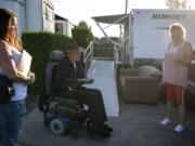 Michele Houston, from left, chats with Bill Wickens and Cindy Genschorck at Hazel Dell RV Park. Wickens has lived at the park for 13 years and said that with the rent increase, 75 percent of his monthly income will go to rent.