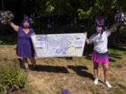 Christyna Hengstler, left, and her friend and co-worker Amanda McCallum pose at Hengstler&#039;s home in Vancouver. With the support of their work, 1st Choice Advisory, the friends are walking together in the Walk to End Alzheimer&#039;s on Aug. 29. Hengstler&#039;s grandmother has Alzheimer&#039;s, and McCallum&#039;s mother passed away from Alzheimer&#039;s.