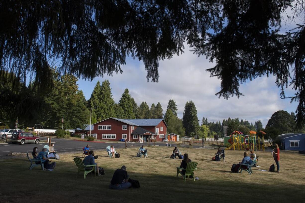 Teachers at the Gardner School of Arts and Sciences practice social distancing as they gather for a meeting on the campus&#039;s yard. The Gardner School, and other private schools in Clark County, will reopen for in-person instruction while public schools continue distance learning. Private schools, however, can be expensive and inaccessible to the majority of families; one expert said the coronavirus pandemic has exacerbated inequities, and that a move to private school education could continue to do so.