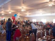 Attendees gather at a meet-and-greet event for Republican candidates at the former Clark County Square Dance Center in Brush Prairie Tuesday, Aug. 25. Around 100 people attended.