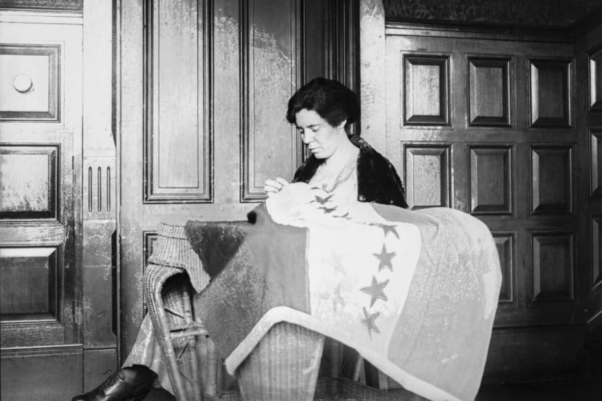 In this 1920s photo, Alice Paul sews a suffrage flag in Washington. One hundred years ago, American women gained the guaranteed right to vote, with ratification of the 19th Amendment. But to suffragist Paul, the vote wasn&#039;t enough. She equipped herself with a law degree and got to work writing another constitutional amendment -- one that would guarantee women equal rights under the law.