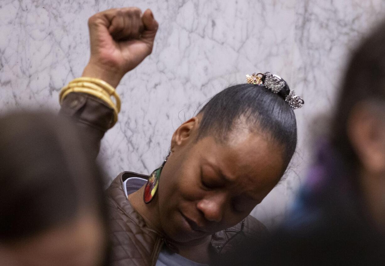 FILE - In this Feb. 20, 2020, file photo, Demetria Hester reacts to verdicts of guilty on all twelve counts at the Jeremy Christian trial in Portland, Ore. One of the protesters arrested in Portland, Oregon early Monday, Aug. 10, 2020, is a Black woman who was assaulted by a white supremacist in a high-profile case three years ago and who now leads a group of "moms" in racial justice protests each night. Hester, 46, was booked on suspicion of disorderly conduct and interfering with a police officer during a protest that began Sunday night and stretched into the early morning hours.