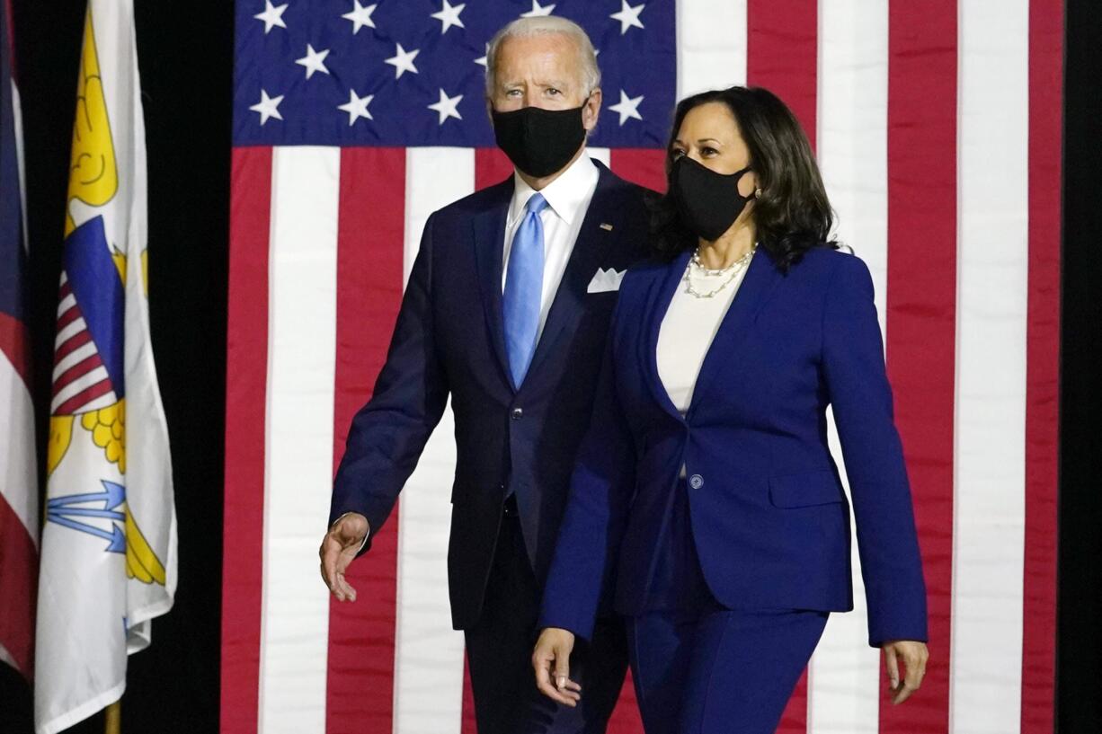 Democratic presidential candidate former Vice President Joe Biden and his running mate Sen. Kamala Harris, D-Calif., arrive to speak at a news conference at Alexis Dupont High School in Wilmington, Del., Wednesday, Aug. 12, 2020.