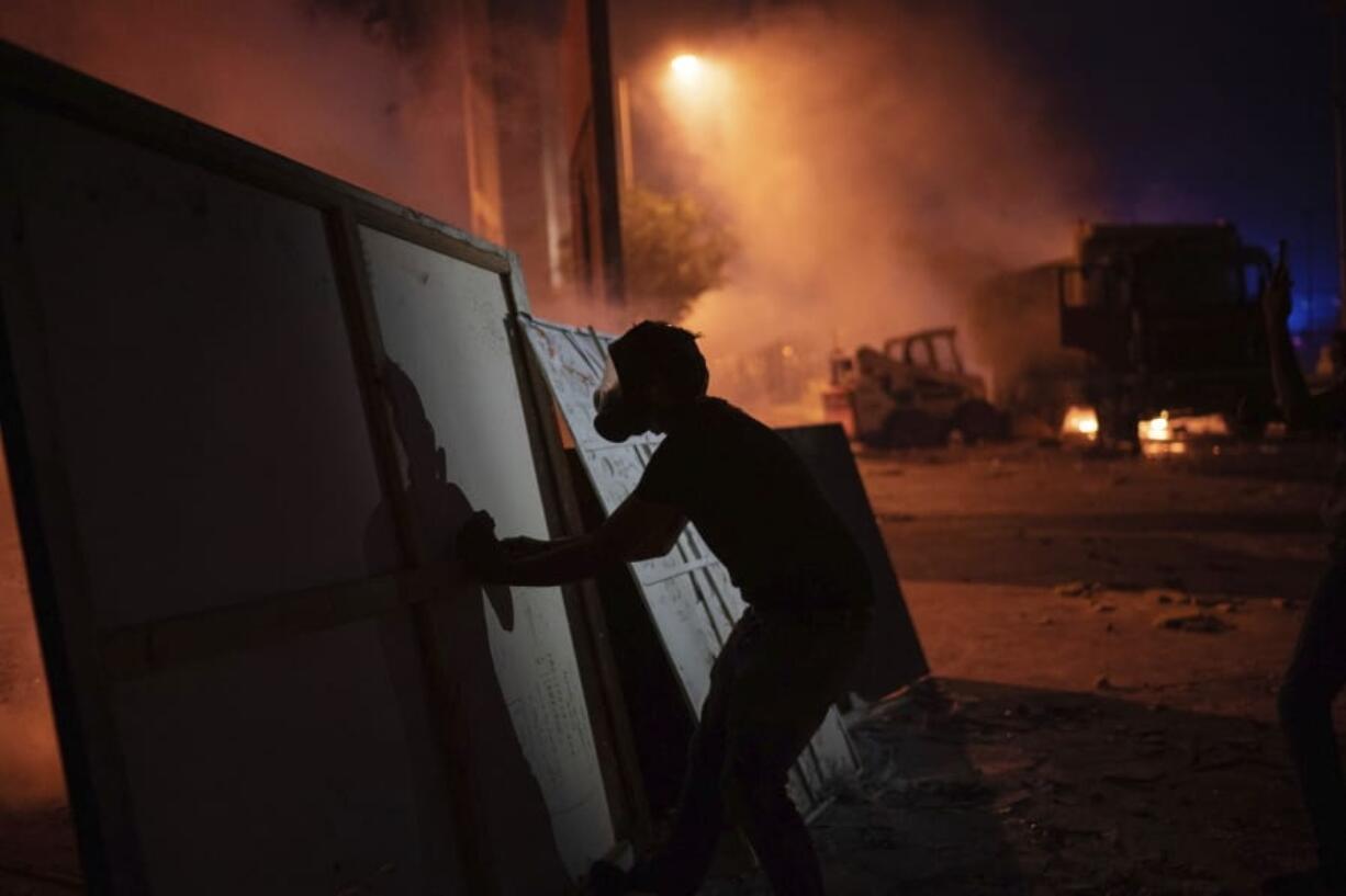 Protesters clash with police during a demonstration against the political elites and the government after this week&#039;s deadly explosion at Beirut port which devastated large parts of the capital, in Beirut, Lebanon, Saturday, Aug. 8, 2020.