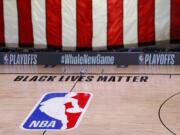 An empty court and bench are shown following the scheduled start time of Game 5 of an NBA basketball first-round playoff series, Wednesday, Aug. 26, 2020, in Lake Buena Vista, Fla. All NBA playoff games scheduled for Wednesday and Thursday were postponed, with players around the league choosing to boycott in their strongest statement yet against racial injustice. (Kevin C.