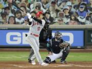 Los Angeles Angels&#039; Shohei Ohtani (17) watches his solo home run as Seattle Mariners catcher Joe Hudson, right, looks on during the second inning of a baseball game Thursday, Aug. 6, 2020, in Seattle. (AP Photo/Ted S.