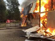 Clark County Fire & Rescue crews were dispatched at 6:56 a.m. to 2015 N.E. 209 Street for the report of a barn on fire. A passer-by reportedly rammed the door of the burning barn to free animals trapped inside.